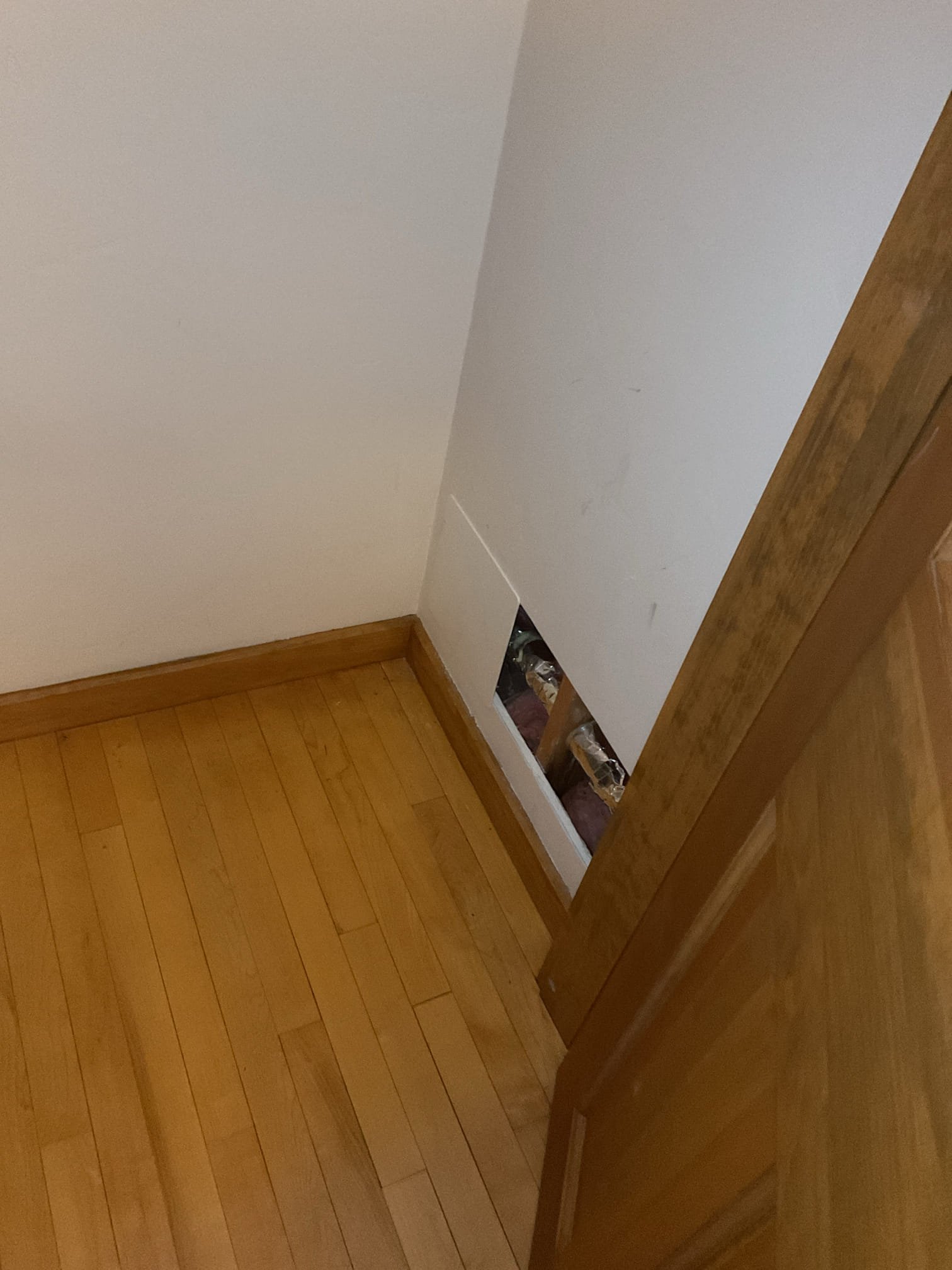 1/12:
We identified an active water leak within the wall but could not determine the exact source without gaining access. The wall was opened near the piping serving the outdoor spigot, and based on audible water movement and visible water staining, the leak was determined to be within the wall cavity. An inspection camera revealed multiple failure points in the existing copper line, indicating widespread deterioration. Due to the extent of damage, we recommend replacing the affected section of piping along with the outdoor hose bibb, upgrading to new PEX water lines with proper insulation to improve reliability and prevent future failures. The leak was isolated using shutoff valves, and the replacement work is scheduled for a later date due to time constraints. The customer was also enrolled in Jerm’s Home Care Club membership program.

1/22
Upon inspection, the exterior hose bib and an attached section of copper piping were found to have burst due to freezing. We recommended replacin