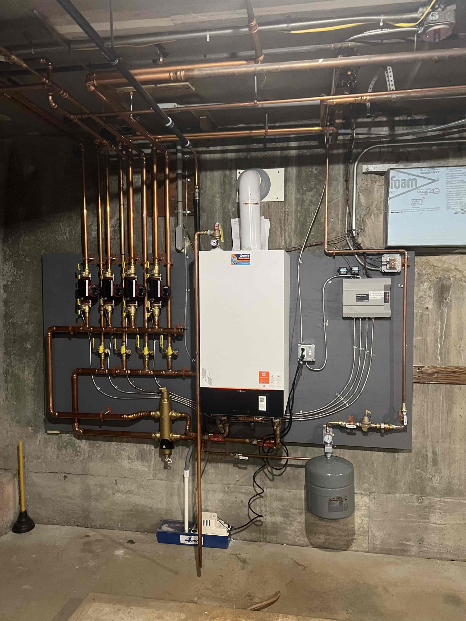 Arrived onsite to investigate no heat in one zone. Upon arrival, the radiators in the bathroom and kitchen were cold. We went downstairs and found the boiler operating properly; however, the pipes for the kitchen zone were not circulating hot water. I attempted to purge the zone, but no water came out, indicating the zone may have been frozen. I increased the system pressure from 12 PSI to 15 PSI, as the boiler gauge reads low. I traced the zone piping into the crawl space and found it ran into the slab to the kitchen. After checking the piping, it began to warm up. I purged the zone again and achieved proper water flow. I allowed the zone to run for a period of time, and the radiators heated up. System is operating properly at this time.