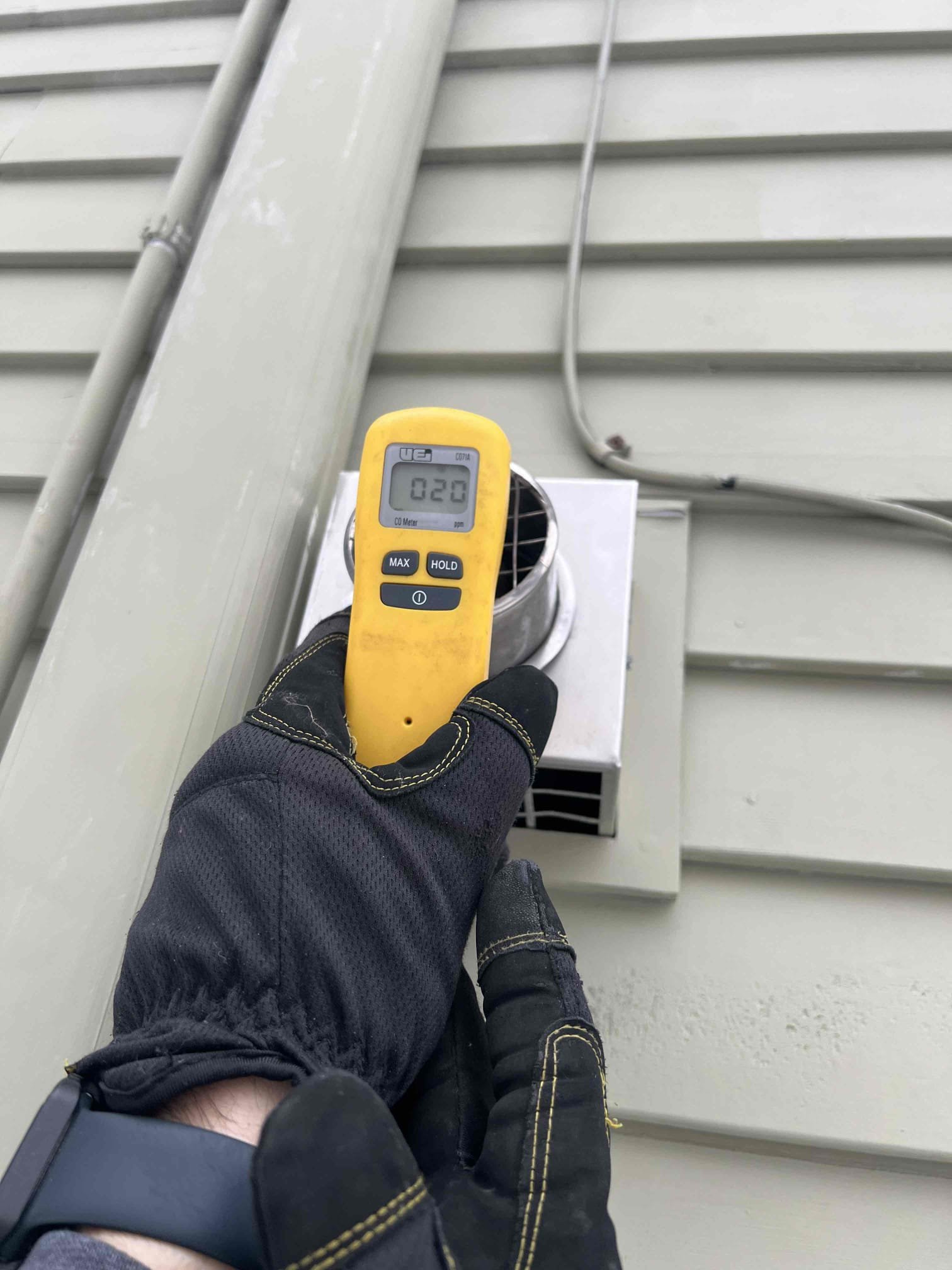 Arrived onsite to investigate a burning smell coming from the boiler. The boiler is located in the garage, and upon entry a burning odor was present. I found insulation resting on top of the boiler and observed black staining on the exhaust pipe, which I believe to be the source of the smell. Carbon monoxide levels were checked and no leaks were detected. Verified proper operation; the system is working properly at this time.