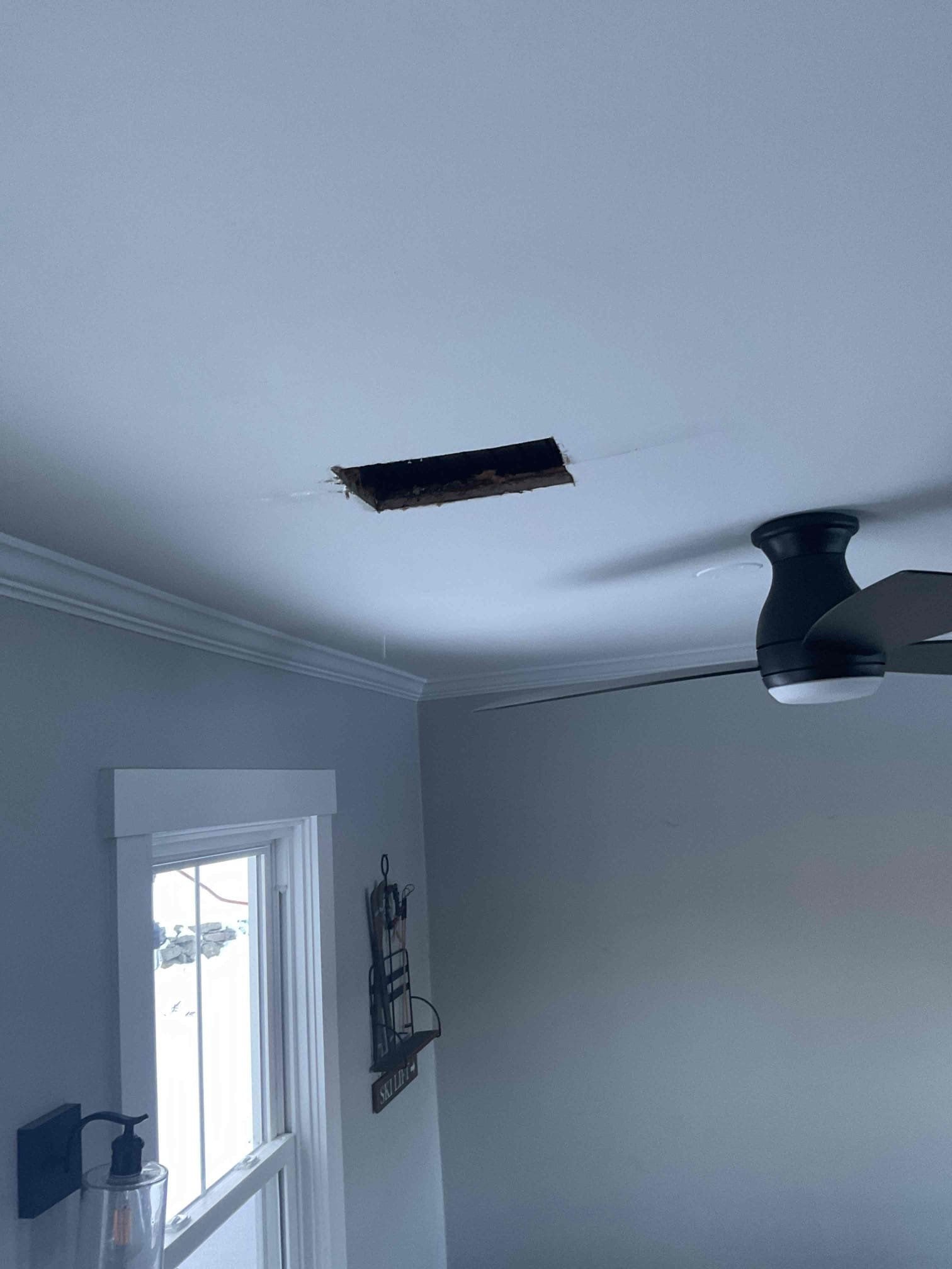 Frozen drainage lines, domestic water lines, and the heating loop were found to be frozen, with a damaged section of piping identified on the heat loop. All affected lines were safely thawed, and repairs were completed on the heating system, including fixing four broken pipes on the main floor heating loop. During the inspection, three additional broken pipes were discovered on the main floor loop, and an active leak was observed in the dining room ceiling, which is believed to be related to the upstairs bathroom soaker tub and will need to be addressed at a later date. Additional diagnostics on the boiler are required, and further repairs will be needed to correct remaining issues. At this time, heat was not able to be restored to that side of the home; however, partial heat is available in other areas of the house, and the affected zone has been shut off for safety.