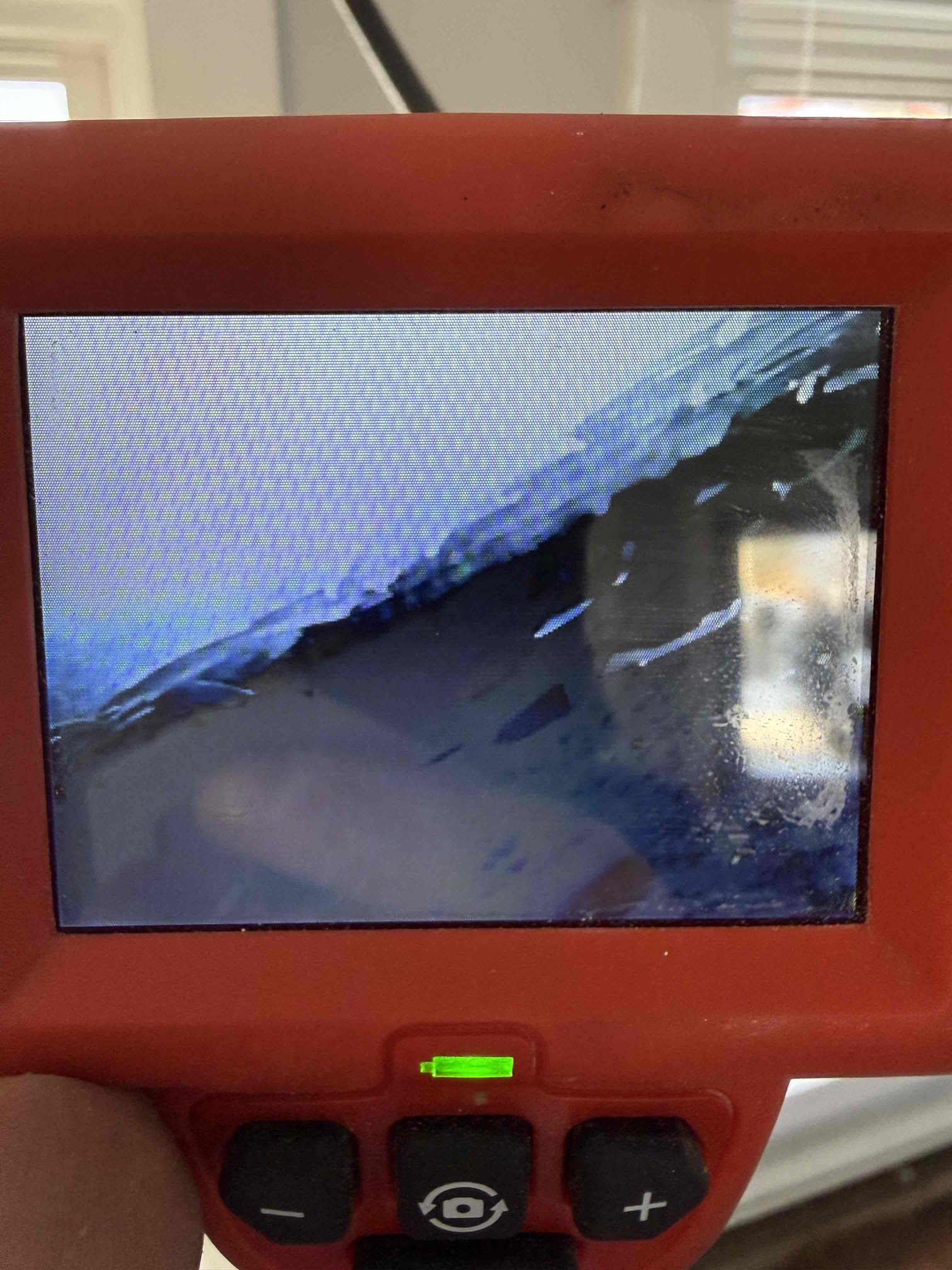 Frozen drainage lines, domestic water lines, and the heating loop were found to be frozen, with a damaged section of piping identified on the heat loop. All affected lines were safely thawed, and repairs were completed on the heating system, including fixing four broken pipes on the main floor heating loop. During the inspection, three additional broken pipes were discovered on the main floor loop, and an active leak was observed in the dining room ceiling, which is believed to be related to the upstairs bathroom soaker tub and will need to be addressed at a later date. Additional diagnostics on the boiler are required, and further repairs will be needed to correct remaining issues. At this time, heat was not able to be restored to that side of the home; however, partial heat is available in other areas of the house, and the affected zone has been shut off for safety.