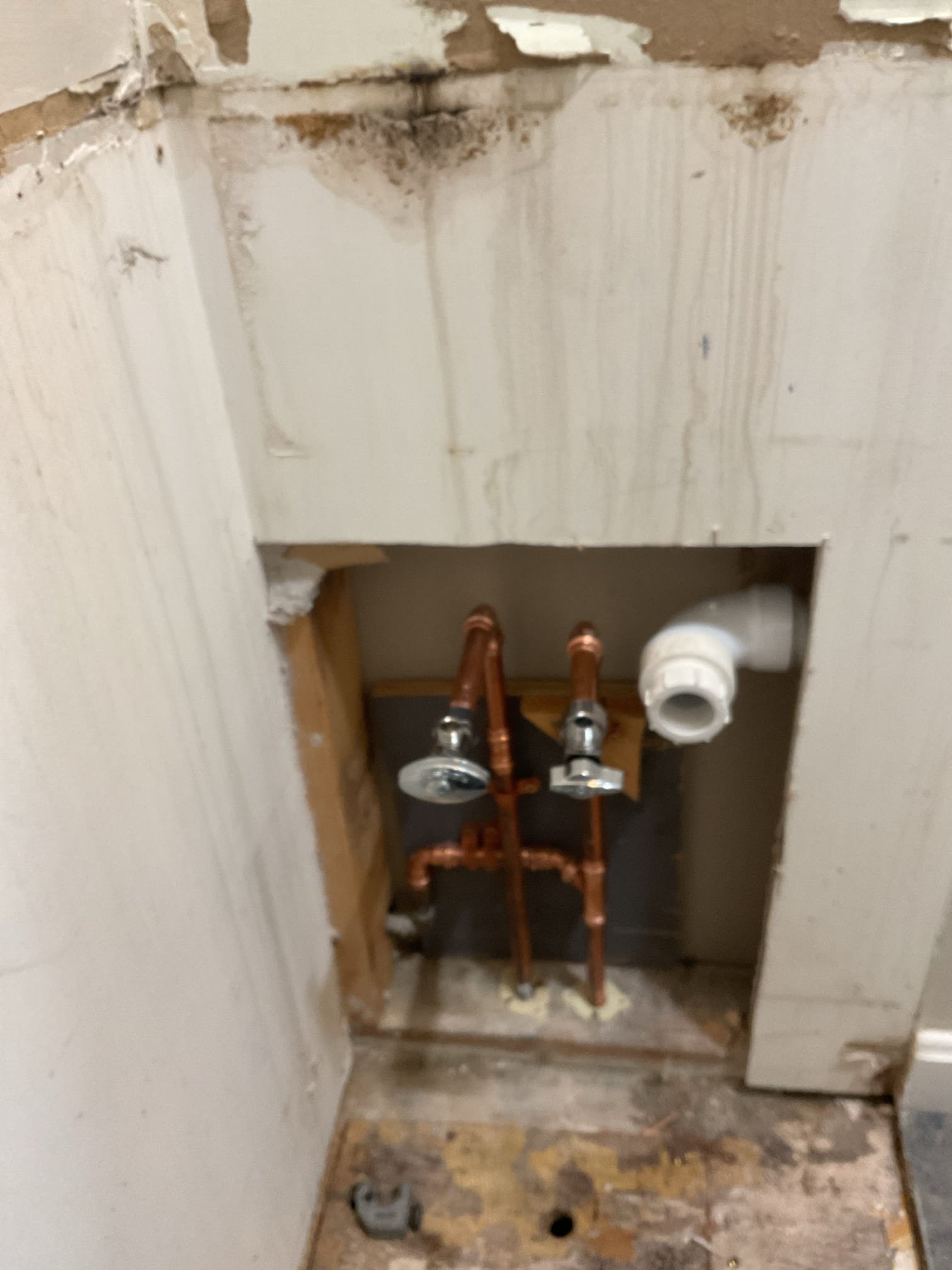 At the homeowner’s request, our team removed the existing bathroom vanity to allow for plumbing modifications in preparation for a new vanity installation. The subfloor was carefully cut and accessed to reroute the existing water supply lines so they now exit through the wall rather than through the floor, accommodating the design and plumbing requirements of the new vanity.

Additionally, the drain line was repositioned and centered to align with a shelf feature in the new vanity, ensuring proper fit, function, and long-term accessibility. All plumbing adjustments were completed to support correct alignment and future installation.

The homeowners elected to handle disposal of the old vanity and installation of the new vanity themselves in order to reduce overall project costs. Our work scope was limited to removal of the existing vanity and completion of the necessary plumbing and subfloor modifications to support the new layout.

Water service was restored upon completion of the wor