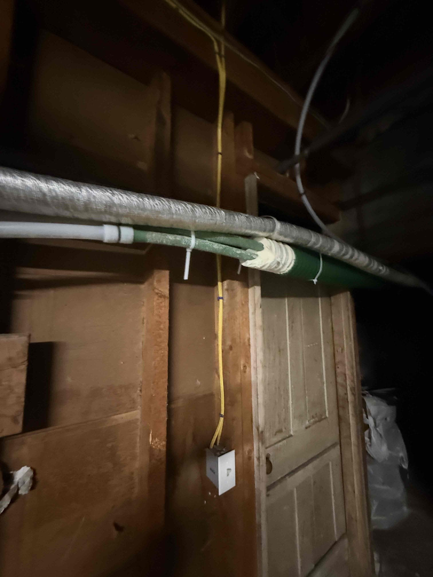 The existing piping located between the two houses where the leak was present was cut out and removed. The damaged section was replaced with new PEX piping of the same size and type, with couplings installed on both ends to ensure secure connections. The new piping was properly hung and supported to maintain correct alignment and prevent future stress. The system was purged of air and tested to verify proper heating operation. All connections were fastened and tested, confirming a leak-free installation and reliable performance.