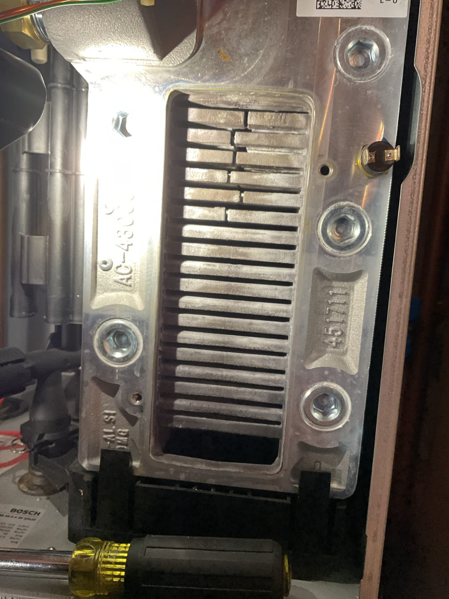 Arrived on site inspect a crackling sound coming from baseboard. Upon our inspection, we found that it was just thermal expansion of the piping through the wall. It was resting on drywall so whenever a call heat came that sound would occur. To remedy this, we tried to put a wall support on the piping but due to the lack of room we could not get it to fit. We ended up trimming down where the piping goes through the wall and used some dry spray foam that was laying around to get the pipe off the wall. Noise no longer occurs.

We also provided an estimate to perform a tune up and replace the igniter electrode on the boiler. Both were accepted. We cleaned the heat exchanger, installed new electrodes, cleaned condensate trap. Once the cleaning was done, we reassembled the boiler and checked around the heat exchanger gasket for any CO leaks. No leaks present. We then performed a combustion analysis. Analysis was good and boiler seems to be operating well.

Daniel did mention they have been h