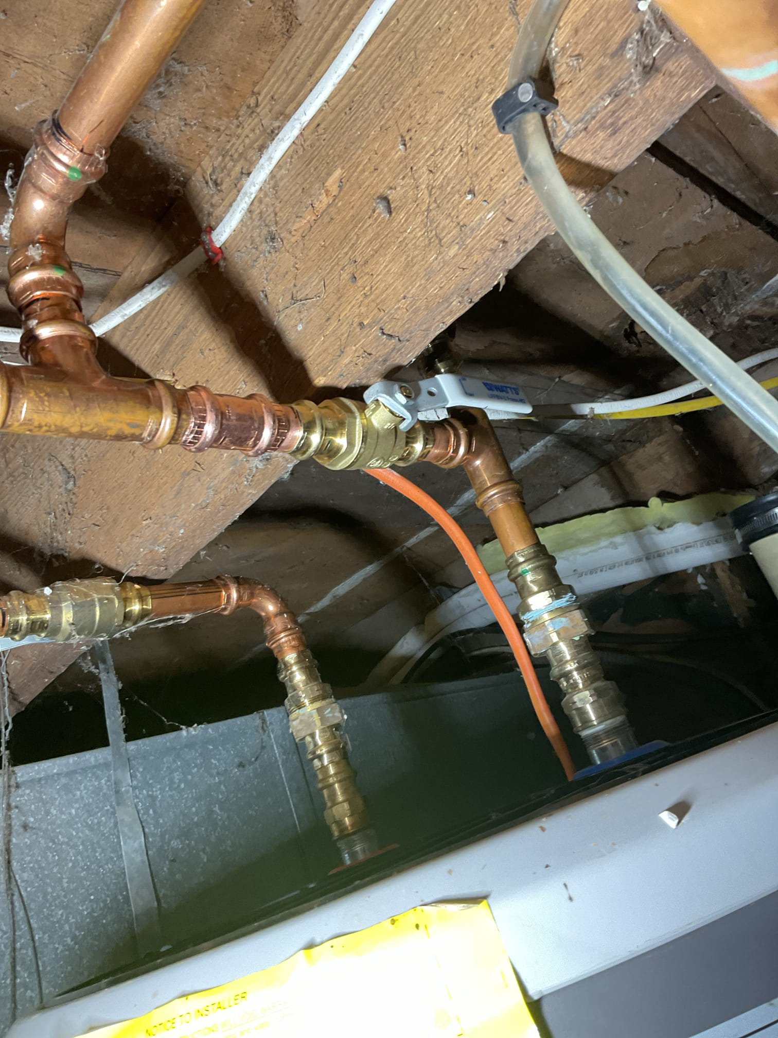 The cold water inlet valve on the water heater was found to be corroded and no longer reliable. We proposed replacing the valve to restore safe, dependable operation and reduce the risk of leaks or potential water damage.

Power was shut off to the water heater and the cold water supply to the building was turned off. The system was fully drained to allow for replacement of the valve. The corroded valve was cut out and removed, with the pipe cleaned and deburred prior to installation. A new quarter-turn shutoff valve was installed using a repair coupling. Water service was restored, the system was pressurized, and all work was tested with no leaks observed at this time.