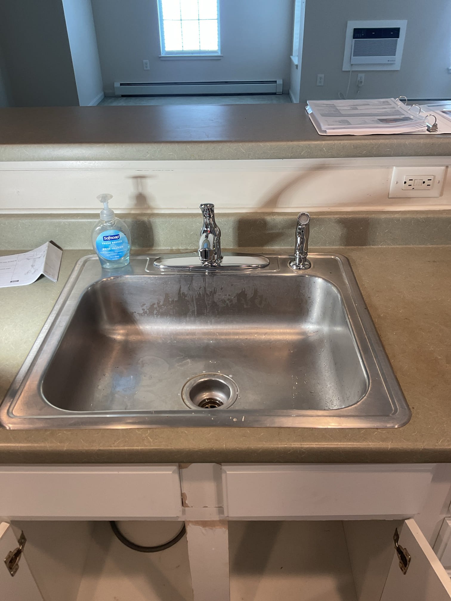 Upon arrival customer had a leaking kitchen faucet. I suggested replacement and customer said he we good to move forward with a replacement. 

In the process of removing the faucet I found it was extremely corroded and rusted in place. The body of the faucet was also rusted which was most likely the cause of the leak. I had to disassemble the faucet with a multitool in order to remove it from the sink. 

I cleaned the surface and installed a new Delta single handle faucet with a side sprayer. I also replaced both braided supply lines to ensure there were no leaks. Everything is functioning properly with no leaks at the time of service. 