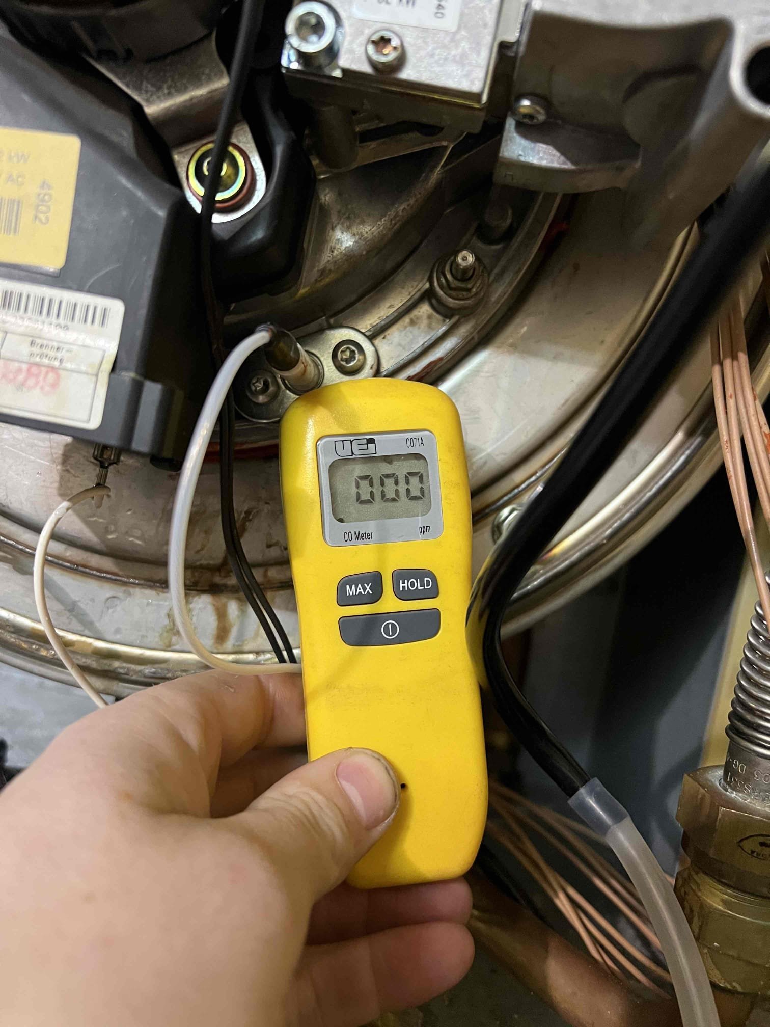 Arrived onsite to investigate a no-heat issue on a Viessmann propane boiler. Another heating company had previously been onsite and cleaned the boiler in an attempt to resolve the issue. During my evaluation, I found the boiler had an FE (flame failure) error code. I reset the unit, and it fired and ran properly .

While inspecting the boiler, I observed water leaking from a crack in the heat exchanger gasket. Due to the gasket not being available from the supply house, I sealed the leak using high-temperature silicone as a temporary repair.

I inspected and cleaned the igniter and flame sensor. I recommend replacing both components if the unit experiences another failure. I also checked gas pressure at the regulator and found it to be low at 10” WC. I adjusted the pressure to 13” WC. I also checked that the boiler is draining condensate properly. Bubble the gas pressure port and checked carbon monoxide levels, no leaks present.

An estimate was emailed to the customer to replace the i