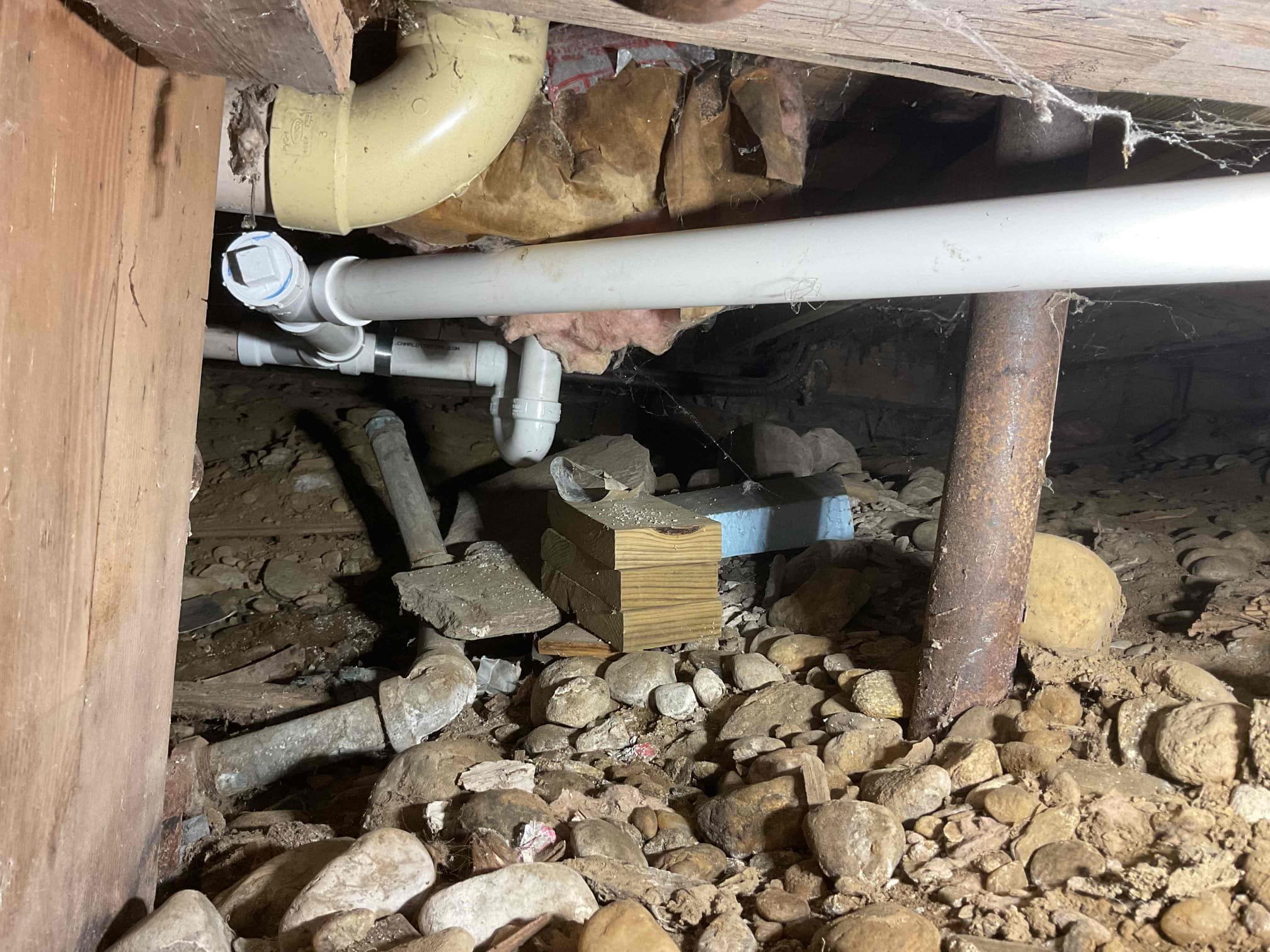 Upon arrival customer had a backed up kitchen sink drain. Drain was back pitched with incorrect fittings and leaking in several spots. This was due to the lack proper supports and non code compliant fittings. To resolve this issue tech recommended cutting out kitchen sink drain and tub trap. Customer signed off on work and techs went forward with the estimate.

Techs started by cutting a hole through the floor under the kitchen sink. Techs then proceeded to remove the air admittance valve, p-trap, kitchen sink drain branch, and tub/shower p-trap. Techs then installed a new air admittance valve, p-trap, kitchen sink drain branch, and tub/shower trap with 4 properly spaced Milford hangers and a clean out for improved support and serviceability. Techs also added a board to patch hole under kitchen sink and escutcheons to cover holes and improve aesthetics.

Techs then ran tub and kitchen sink for approximately 20 minutes to test for leaks and proper drainage. Drains held and drained prope