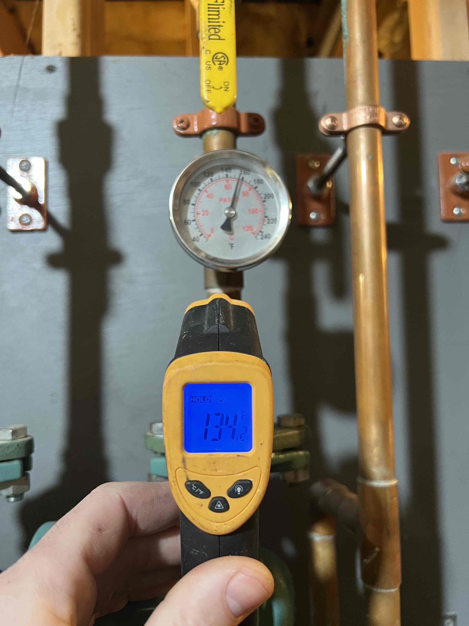 Arrived on site to investigate insufficient heat in the mudroom. This area is heated by a radiant zone, and the system has been struggling to keep up during very cold temperatures.

Upon arrival, the thermostat was set to 66°F and the room temperature was 65°F. It was also noticeably warmer outside today compared to recent days. I checked the radiant supply temperature, which was at 140°F—the maximum I would recommend for this application. Floor temperature was measured at 80°F, which is appropriate for radiant heat and indicates the system is operating as designed.

The thermostat in this room is known to be inconsistent, which may be contributing to the issue. I recommended replacing the thermostat. Estimates to replace it were emailed to the customer, and they will advise if they would like us to proceed.