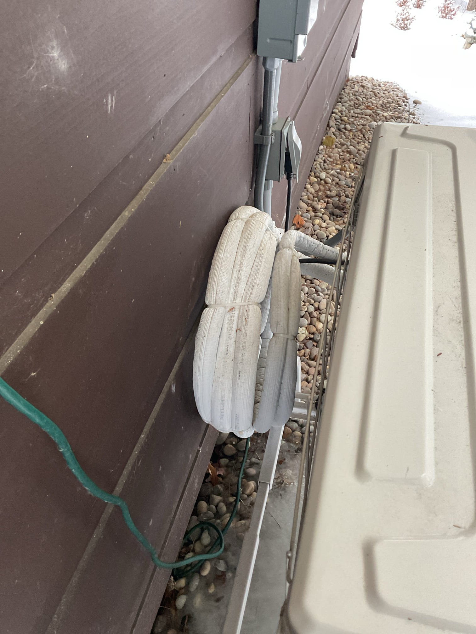 Arrived on site to inspect Minisplit excessively icing up under the unit. We found that the unit is tipping quite a bit toward the house. We believe that the pad or the ground had shifted and is causing the ice melt from the unit is dripping backward toward the house. We will need to wait for the ice to melt before we can fix the pad. We will try to pitch the unit so that it is not draining toward the house.

Heather also mentioned the thermostat in one of the floor units is still a problem and would like it fixed. 