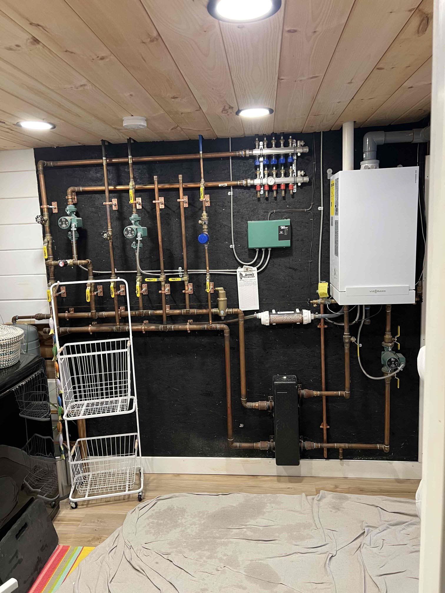 Arrived on site to perform an annual tune-up on a Viessmann propane boiler and tankless water heater. The water heater is high voltage electric and we don’t service them. Performed annual tune up on a Viessmann propane boiler, cleaned the burner, heat exchanger, igniter, flame sensor, and condensate trap. Inspected the expansion tank, neutralizer, combustion, venting, and overall hydronic system operation. Replaced leaking relief valve and piped it to within 6 inches of the floor. Bubble-tested the gas line and checked carbon monoxide levels; no leaks were found. Verified proper operation, and the system is working correctly at this time.
