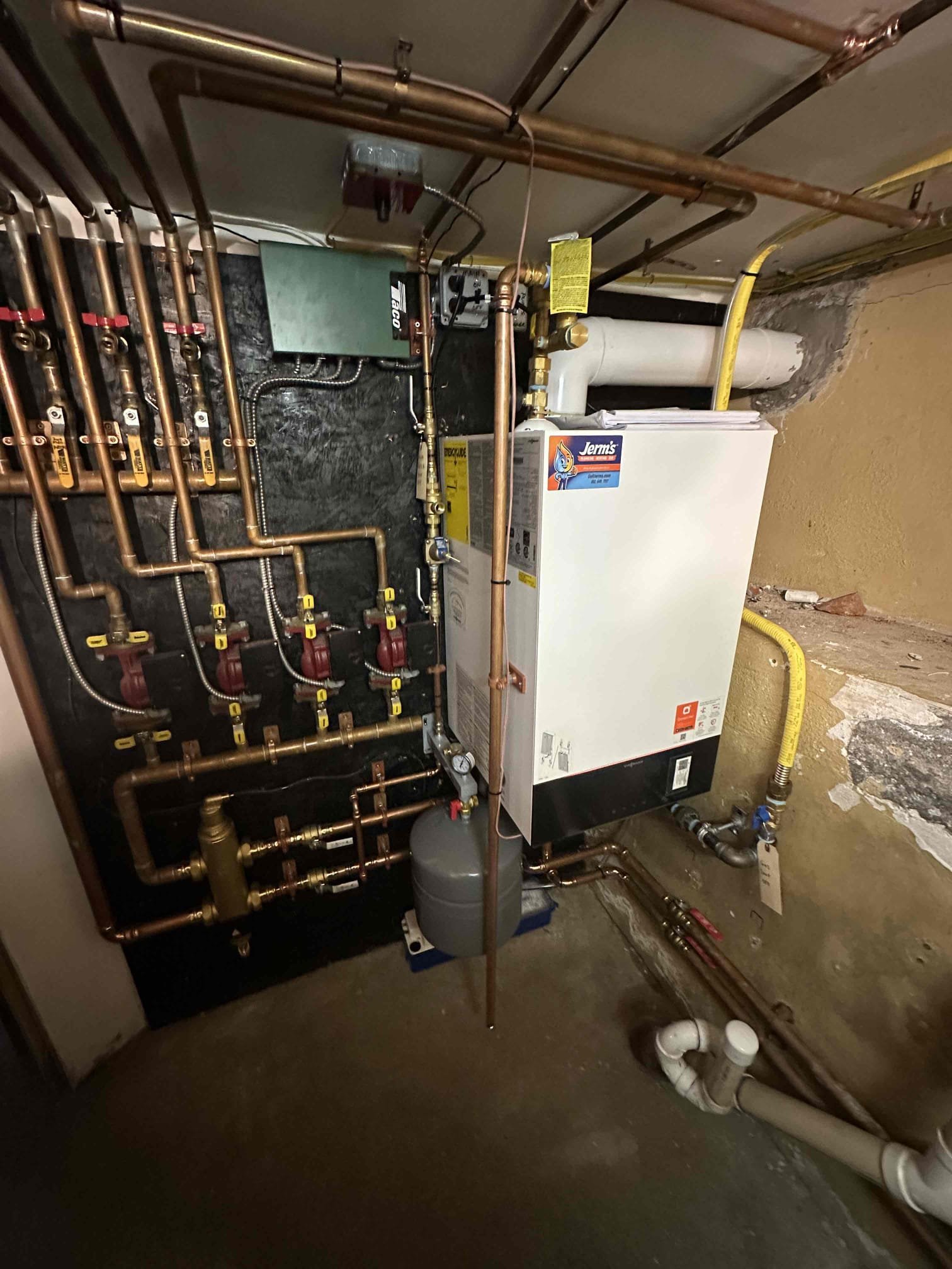 I removed the existing boiler and indirect water heater along with all associated venting and components, and installed a new Viessmann Vitodens 100 propane boiler and a Rheem indirect water heater. The new boiler was connected to the existing heating manifold, and the gas line was connected and tested with a bubble test and full leak check to confirm there were no leaks. All connections were verified secure.

A condensate pump was installed to neutralize and discharge condensation from the boiler to the washing machine drain. The gas shutoff and water shutoff valves were clearly labeled. New concentric venting was installed from the boiler to the exterior of the home. The venting was properly supported with hangers, and all penetrations were sealed with spray foam, furnace cement, and silicone to ensure an airtight and weather-tight seal.

A mixing valve was installed on the indirect water heater. The indirect water heater was set to 140 degrees, and the mixing valve was set to delive