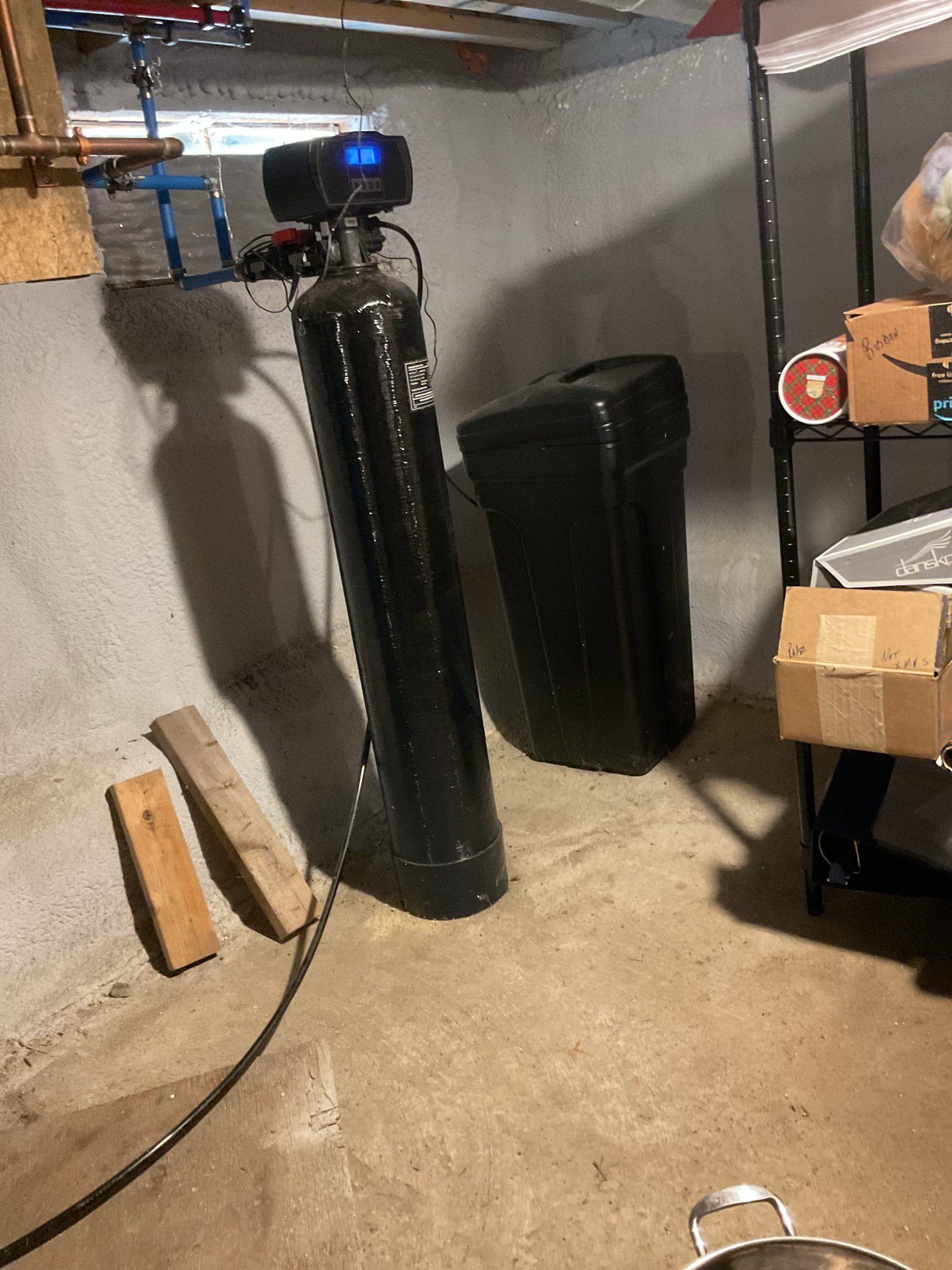 Upon arrival, we responded to a reported leak and conducted a thorough inspection of the surrounding bathroom fixtures, confirming that no fixtures in the area were actively leaking. During further investigation, we observed that the water softener discharge line was routed into a pit, where water was present on the floor and the surrounding area was wet. The homeowner advised that the water softener had not been in use until recently, which coincided with the appearance of the moisture. To stop the issue and prevent further discharge, the water softener was unplugged and placed into bypass mode. After completing these steps, the area was monitored and no additional water discharge was observed. The customer was satisfied with the results and agreed that the water softener was the likely source of the problem.