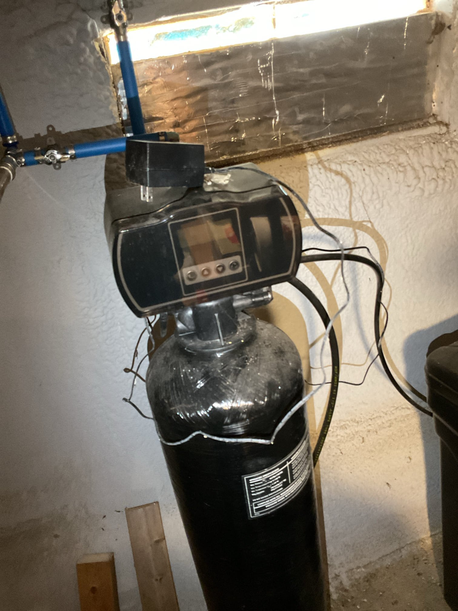 Upon arrival, we responded to a reported leak and conducted a thorough inspection of the surrounding bathroom fixtures, confirming that no fixtures in the area were actively leaking. During further investigation, we observed that the water softener discharge line was routed into a pit, where water was present on the floor and the surrounding area was wet. The homeowner advised that the water softener had not been in use until recently, which coincided with the appearance of the moisture. To stop the issue and prevent further discharge, the water softener was unplugged and placed into bypass mode. After completing these steps, the area was monitored and no additional water discharge was observed. The customer was satisfied with the results and agreed that the water softener was the likely source of the problem.