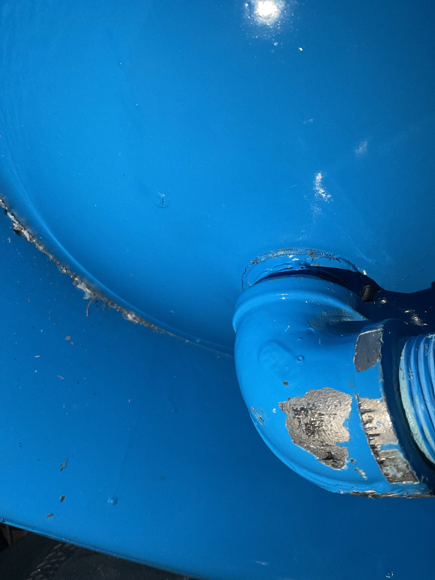 The existing 32-gallon pressure tank had failed and was no longer operating properly. We will replace it with a new Well-X-Trol pressure tank to restore reliable water pressure and improve overall system performance. During the previous visit, we confirmed the tank had completely failed: after draining the system, the bladder pressure measured 3 PSI (should be 38 PSI), and the tank was fully waterlogged. The tank pressure was temporarily increased to 28 PSI until replacement could be completed.

2/20 — Installation Visit
We returned to install the new 32-gallon Well-X-Trol pressure tank, reusing the existing tank tee and assembly. Power to the system was shut off and the system was fully drained. The tank union was disconnected and the failed tank was removed; due to being completely waterlogged, the tank was plugged for transport to prevent water leakage inside the home. The new tank was prepared by removing the pre-threaded extension and installing the existing tee union. Silicone lu