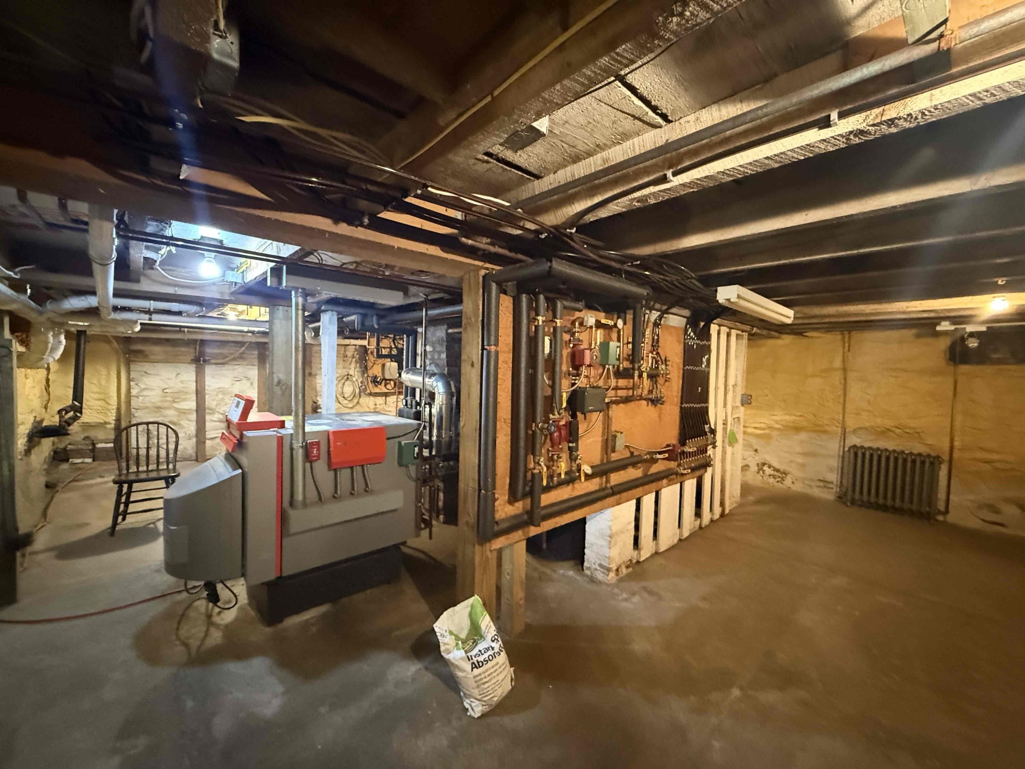 Performed a site visit to evaluate the boiler system configuration. Isolated the wood boiler by closing the appropriate valving to prevent it from drawing water from the oil boiler. Labeled the valve for clear identification in the event the customer chooses to place the wood boiler back into operation.