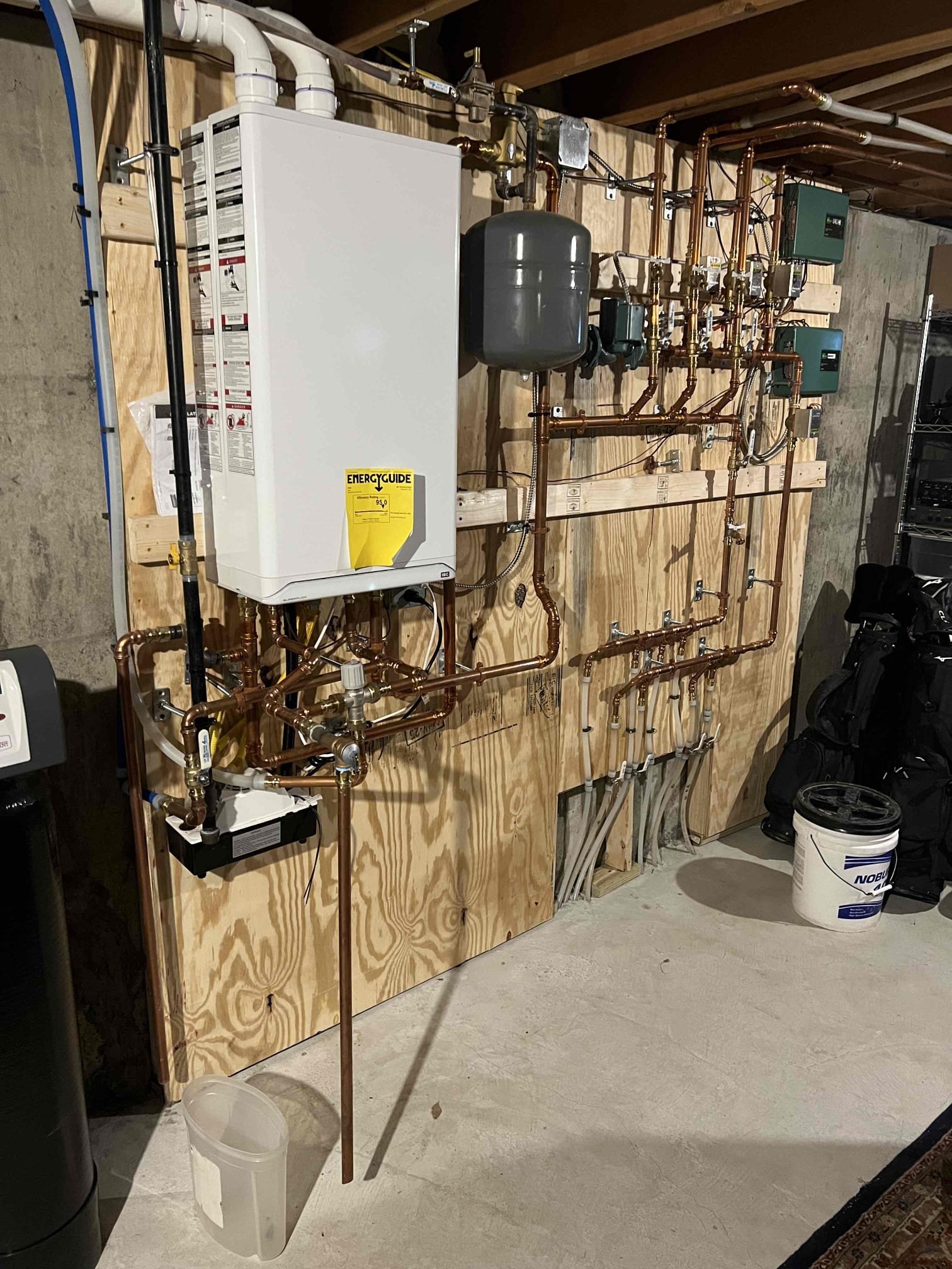 Arrived onsite to evaluate a new installation. Upon arrival, I observed multiple issues that needed to be addressed. I discussed these findings with the customers, and they approved the work to pipe the relief valve to the floor and to diagnose the blinking Taco zone valve control.

I tested all thermostats and verified they are operating properly. The blinking light is the result of a communication error caused by the current system wiring. The customers also requested that the chimney opening from the old boiler vent be capped.

Additional deficiencies noted include the need for a mixing valve, a backflow preventer, rotation of the main circulator, and installation of a 4-inch sediment trap on the gas line. I will prepare an estimate for the above work.

At this time, the system is providing heat and domestic hot water, but it is not heating the house effectively. Installing a mixing valve for the radiant zone will allow the high-temperature zone to be increased to 180°F, which will 