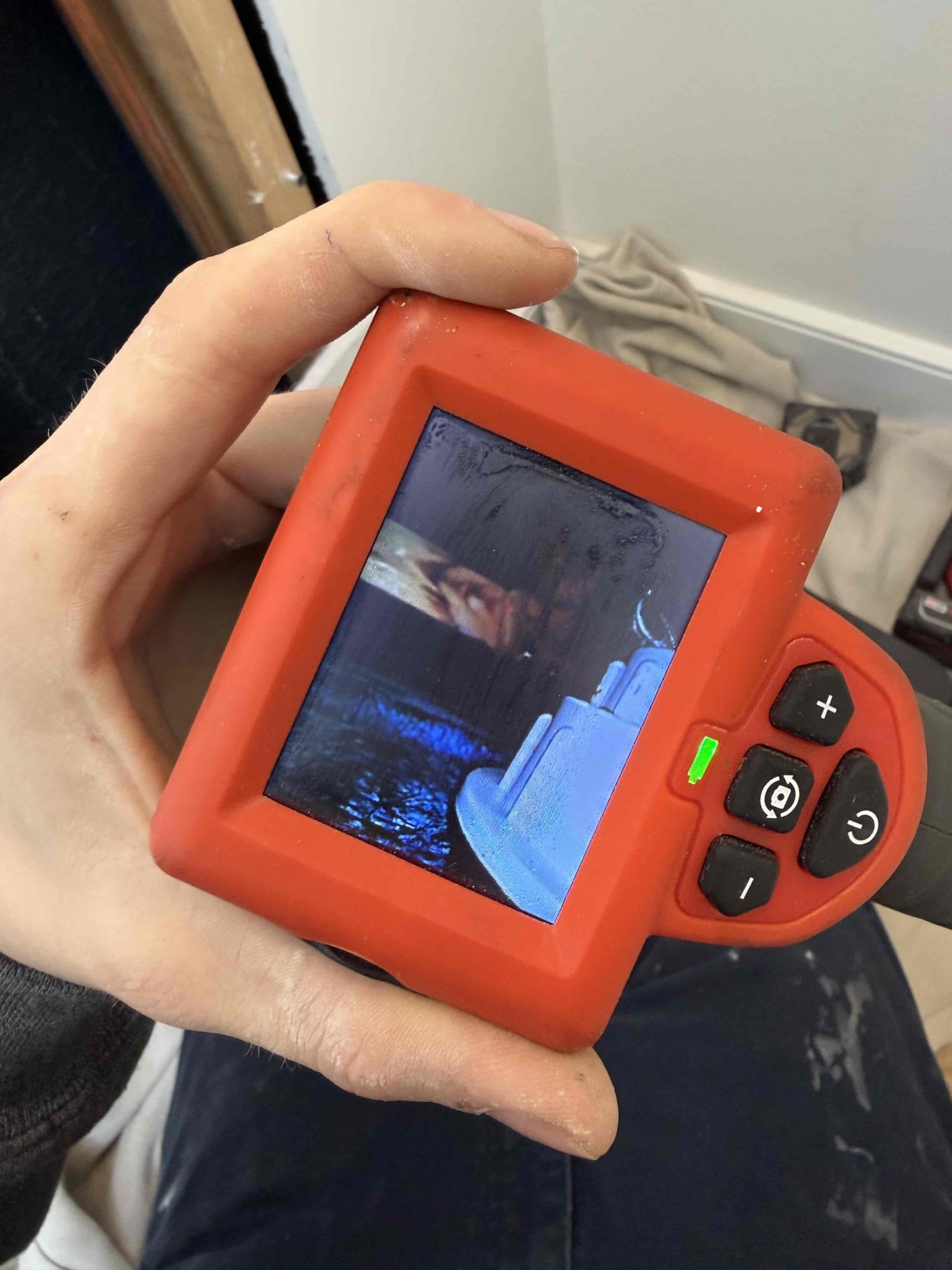 For this job, we responded to inspect a leak reported in the guest bathroom shower. The customer stated that water had been left running while he was away and later noticed water pooling in the kitchen ceiling area directly below the shower. To properly diagnose the issue, an access hole was cut in the bathroom wall to inspect the shower valve and drain assembly. The shower was operated and multiple buckets of water were poured into the base to test the drainage system, and no leaks were found coming from the drain. During inspection, we discovered water leaking from behind the shower valve trim plate. The trim plate was properly sealed with silicone to prevent further water intrusion. We also observed unfinished trim on the exterior edge of the shower, which may have contributed to water escaping the enclosure. Additionally, the kitchen faucet was tightened after noting it was loose. All work was completed, the area was checked for active leaks, and the customer was satisfied with the