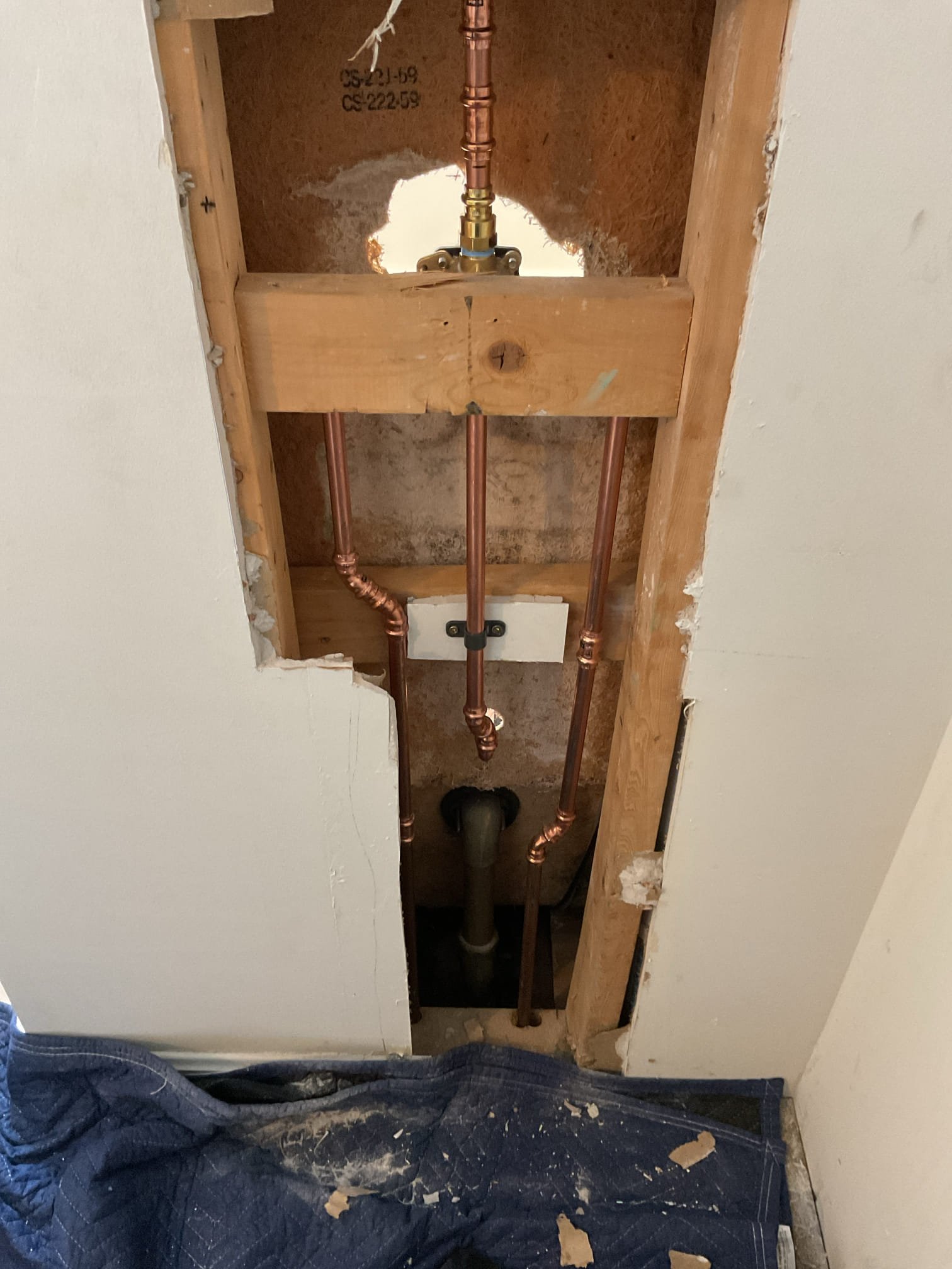 During this service visit, we installed the homeowner-supplied tub and shower faucet assembly. All domestic hot and cold water supply lines were connected to the new valve, and additional blocking was installed within the wall cavity to properly secure and stabilize the valve body. The valve was anchored to ensure long-term durability and to prevent movement behind the finished wall surface.

As installation neared completion, it was identified that the shower trim plate would not fully cover the existing wall opening. To properly correct this issue and ensure full coverage of the wall penetration, the shower valve was repositioned. This adjustment resulted in a slight misalignment between the shower valve and the tub spout, waste, and overflow trim; however, the revised placement ensures the wall opening will be completely concealed by the trim plate once installed. All domestic water connections were disconnected and re-made following the valve relocation, and supply lines were check