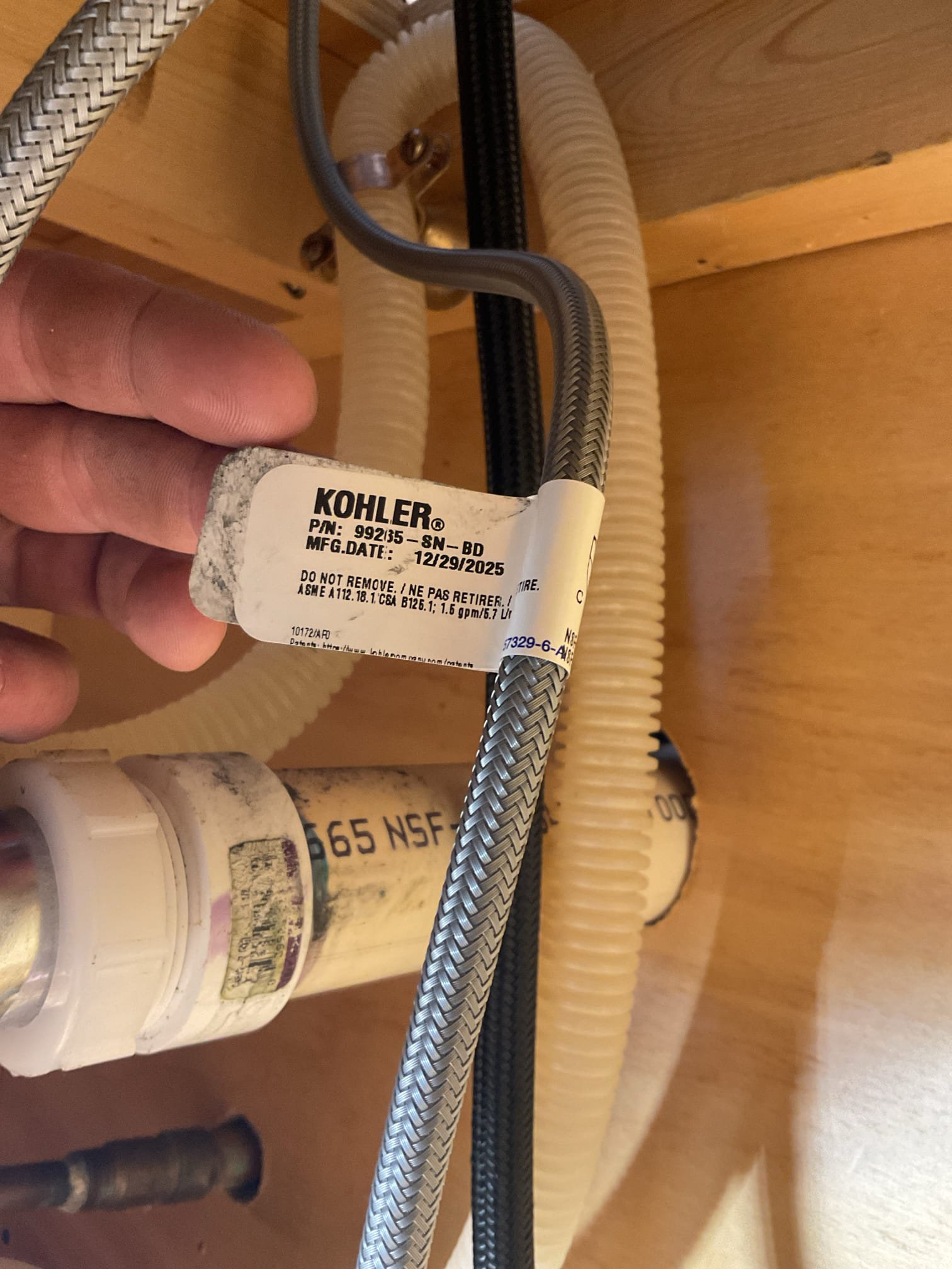 The existing kitchen faucet was outdated and was replaced with the new customer-supplied unit, providing improved appearance, reliable operation, and enhanced everyday functionality. Water was shut off under the sink using the existing multi-turn valves, and the packing nut on the hot side valve was tightened to address a minor drip. The old faucet with side sprayer was removed, surfaces were cleaned, and the new customer-supplied Kohler faucet with side sprayer was installed and securely fastened to the countertop. Water supply lines were reconnected, the water was turned on, and the faucet was tested with no leaks or issues at this time.

The upstairs bathroom shower diverter is not operating properly, preventing normal use of the tub spout and shower. Diagnostics confirmed the diverter cartridge was completely seized along with the diverter handle assembly. Freeing lubricant was applied to multiple points to verify the tub spout was not the cause of the issue, and the trim was disas