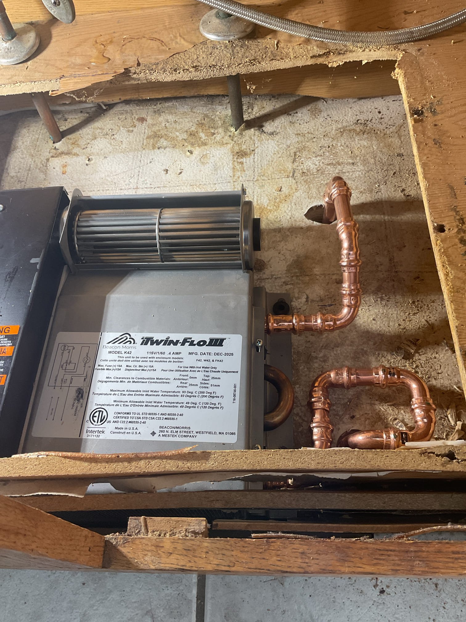 On our return visit, we installed the properly sized toe kick heater after determining during the previous appointment that the customer-supplied unit was oversized for the space and application. We removed the existing toe kick heater and installed the new correctly sized unit. The piping was altered and reconfigured as needed to accommodate the updated layout and ensure proper alignment and connection. Once installation was complete, we restored the system to operation and thoroughly tested the unit for proper function and heat output. All connections were inspected under operating conditions, and no leaks were present at the time of service completion. The unit is operating as designed.

During the same visit, we addressed a reported issue of the toilet leaking into the basement when flushed. We shut off the water supply, drained the fixture, and removed the toilet to inspect the cause of the leak. Upon further evaluation, we found that the toilet flange is deteriorated and no longe