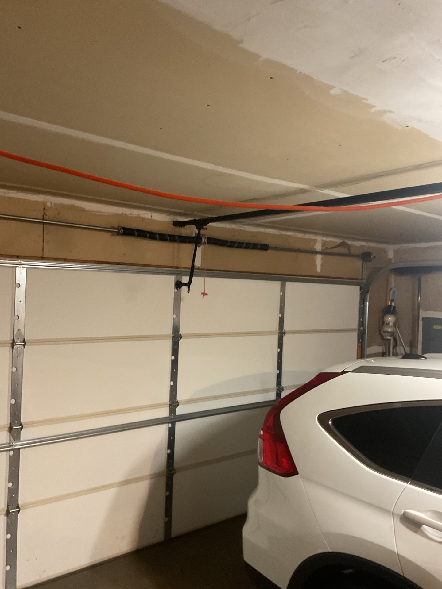 Upon inspection, the garage door exhibited significant sagging in a specific section, compromising its functionality and safety. To address this, I first identified the weakened area and assessed the structural integrity of the struts. The sagging was due to a compromised strut, which had lost its ability to support the weight of the door. I replaced the faulty strut with a new, high-quality one to restore its strength. Additionally, to prevent future sagging, I reinforced the garage door panel with additional support brackets. This reinforcement ensured the panel could withstand regular use and environmental factors. After completing the repairs, I tested the door to confirm it operated smoothly and safely. The garage door now functions optimally, providing reliable access and security.