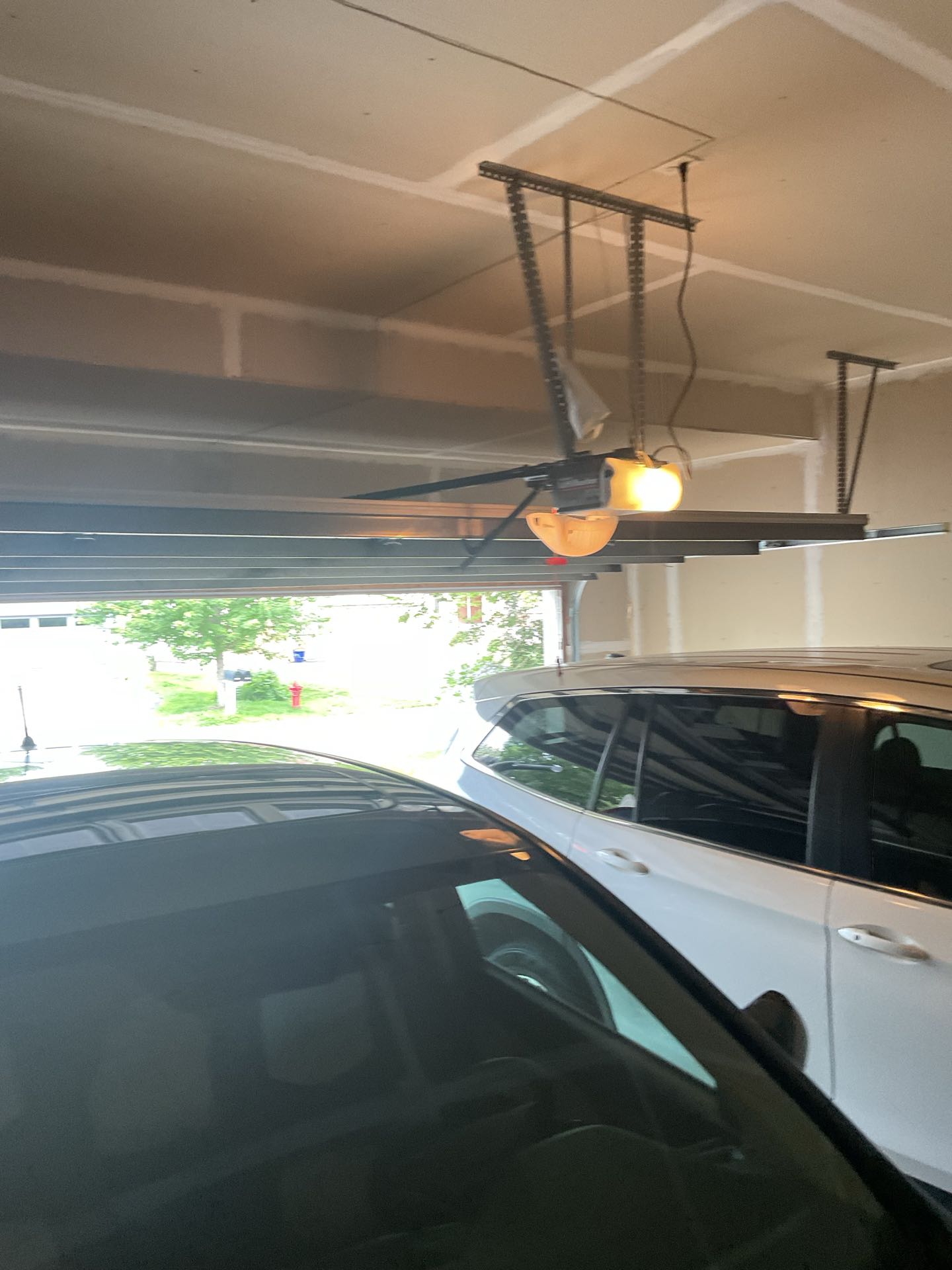 Upon arrival, I assessed the garage door and identified a broken torsion spring as the issue. This spring is crucial for the door's operation, and its failure could lead to further damage if not addressed promptly. I began by disconnecting the broken spring from the garage door mechanism, ensuring safety by securing the door in the closed position. Next, I carefully removed the old spring, taking note of its specifications for an accurate replacement. I then installed a new torsion spring, matching the specifications of the original to ensure optimal performance. After the installation, I reattached the safety cables and adjusted the tension to meet manufacturer guidelines. Finally, I 