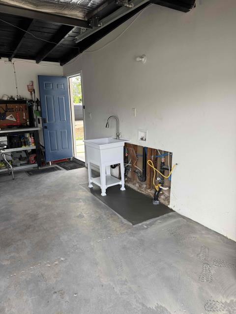 We rerouted kitchen and laundry drains, installed a new drain line, and replaced the water heater. We sawed and removed concrete, bored a new pathway, and tested the system.