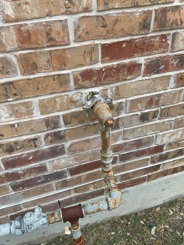 Performed electrical maintenance inspection on a 2013 home with one breaker panel located in the garage. Conducted comprehensive inspection of the electrical panel, documenting rust on exterior plumbing components and examining breaker connections, wiring condition, and panel integrity. Completed full electrical system tune-up to ensure proper functionality.