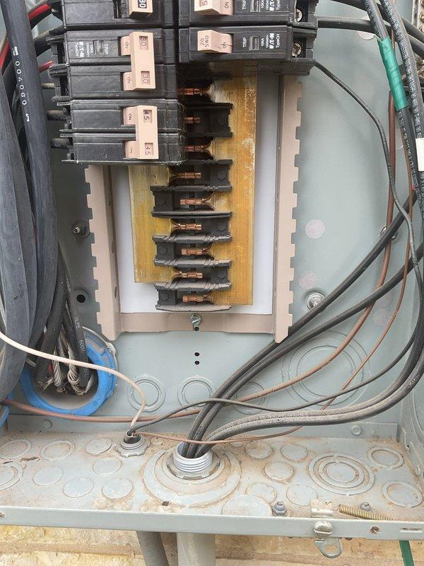 Performed electrical maintenance inspection on a 2013 home with one breaker panel located in the garage. Conducted comprehensive inspection of the electrical panel, documenting rust on exterior plumbing components and examining breaker connections, wiring condition, and panel integrity. Completed full electrical system tune-up to ensure proper functionality.