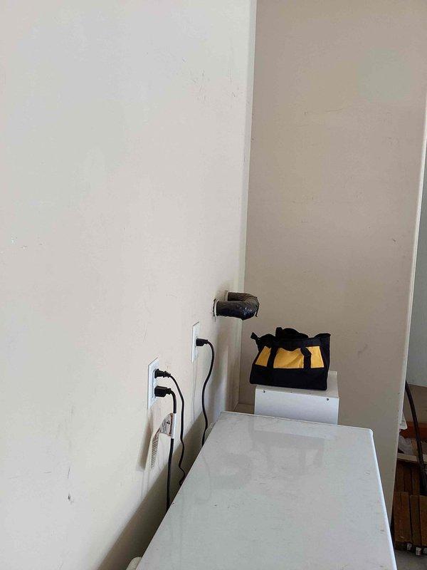 Performed diagnostic inspection on a 2-year-old Rheem Classic Series Professional gas tank water heater located in garage. Unit appears to be functioning properly with no visible damage, rust, or leakage; all connections, venting, and pressure relief valve were verified to be in good working condition.