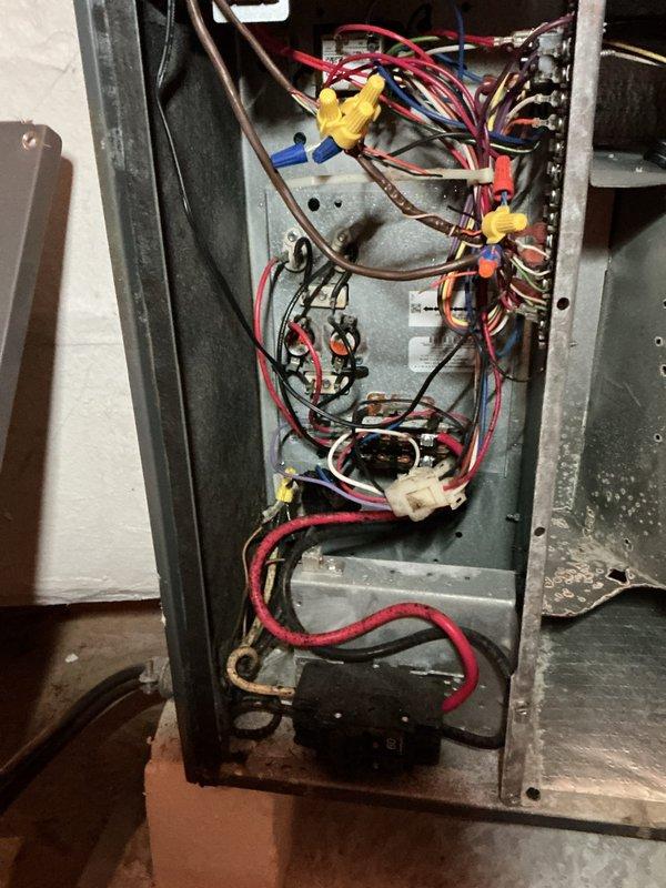 Completed spring maintenance on 5-year-old heat pump system located in attic. Performed standard seasonal inspection including visual examination of electrical components, wiring connections, and control board. Measured and documented electrical readings using digital multimeter at outdoor unit, recording voltage of 103.3V. Inspected interior electrical compartment, noting multiple wire connections, contactors, relays, and transformer. System currently operational with no immediate safety concerns identified during maintenance visit. Customer previously declined recommended service appointment for ongoing thermostat issues and heat pump diagnostic concerns noted during fall maintenance, including system running on emergency heat strips and suspected low refrigerant levels. Thermostat O terminal voltage fault remains unaddressed from prior visit. All standard maintenance procedures completed per membership agreement protocols.