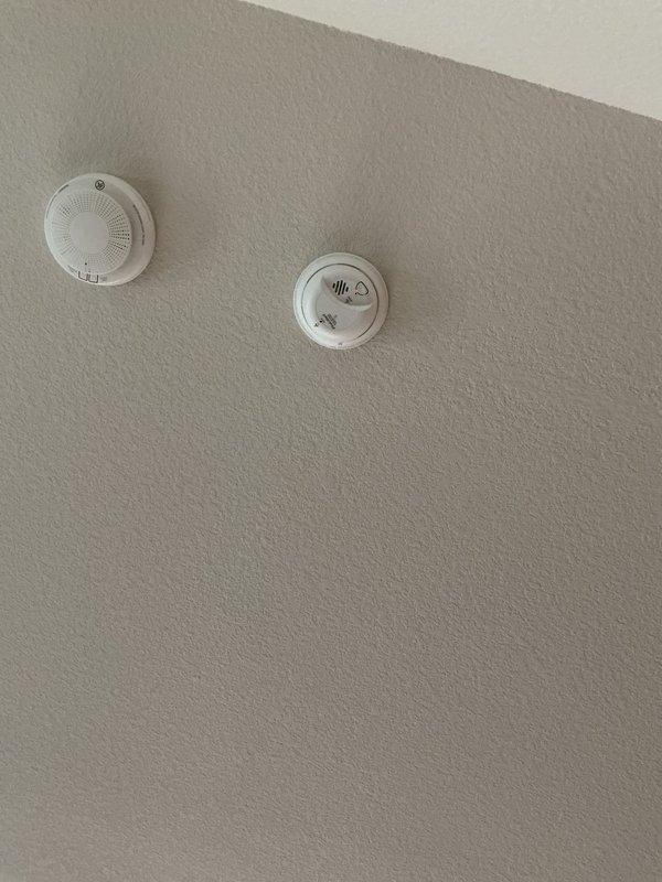 Responded to a non-operational bedroom ceiling fan that would not turn on from the wall switch. Upon inspection, discovered faulty wiring connections at the ceiling fan mounting bracket. Disconnected power at the breaker, removed the fan canopy, and found loose and improperly terminated wire connections at the junction box. Re-stripped and properly secured all electrical connections using approved wire connectors, ensuring proper contact between line voltage wires and fan leads. Verified secure mounting of the fan to the existing ceiling box and bracing system. Restored power and tested fan operation through all speed settings and light functions from the wall control panel, confirming full functionality. System now operates as intended with all controls responding properly.