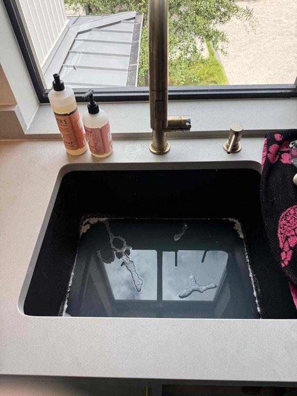 Responded to upstairs bathroom sink stoppage in 3-year-old residence. Successfully cleared drain obstruction in Kohler undermount lavatory basin using mechanical cable auger, restoring proper drainage and flow. Tested fixture operation with widespread faucet assembly to confirm complete clearance and verified no leaks at trap connections upon completion.