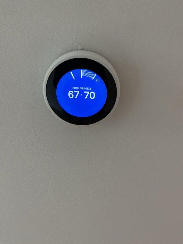Responded to thermostat displaying wiring error message in 3-year-old residence. Performed comprehensive electrical diagnostic of thermostat wiring and HVAC control circuit. Inspected thermostat connections, verified proper wire terminations at both thermostat location and air handler, and tested voltage levels across all control wires. Confirmed all electrical connections were secure and properly landed. Cleared error code and restored thermostat to normal operation, with unit successfully calling for cooling on Stage 2. Advised that HVAC system evaluation may be warranted if error recurs, as issue could be related to equipment communication rather than electrical wiring fault.