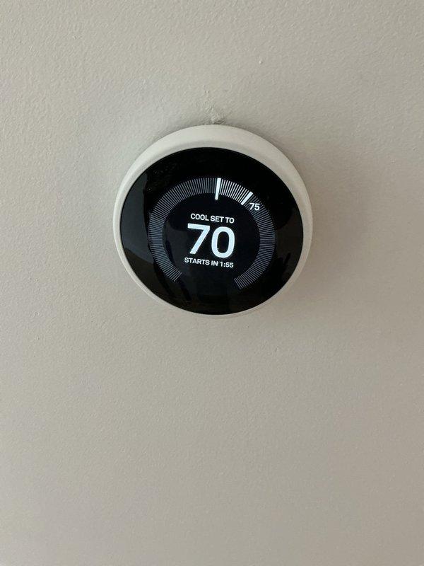 Responded to thermostat displaying wiring error message in 3-year-old residence. Performed comprehensive electrical diagnostic of thermostat wiring and HVAC control circuit. Inspected thermostat connections, verified proper wire terminations at both thermostat location and air handler, and tested voltage levels across all control wires. Confirmed all electrical connections were secure and properly landed. Cleared error code and restored thermostat to normal operation, with unit successfully calling for cooling on Stage 2. Advised that HVAC system evaluation may be warranted if error recurs, as issue could be related to equipment communication rather than electrical wiring fault.