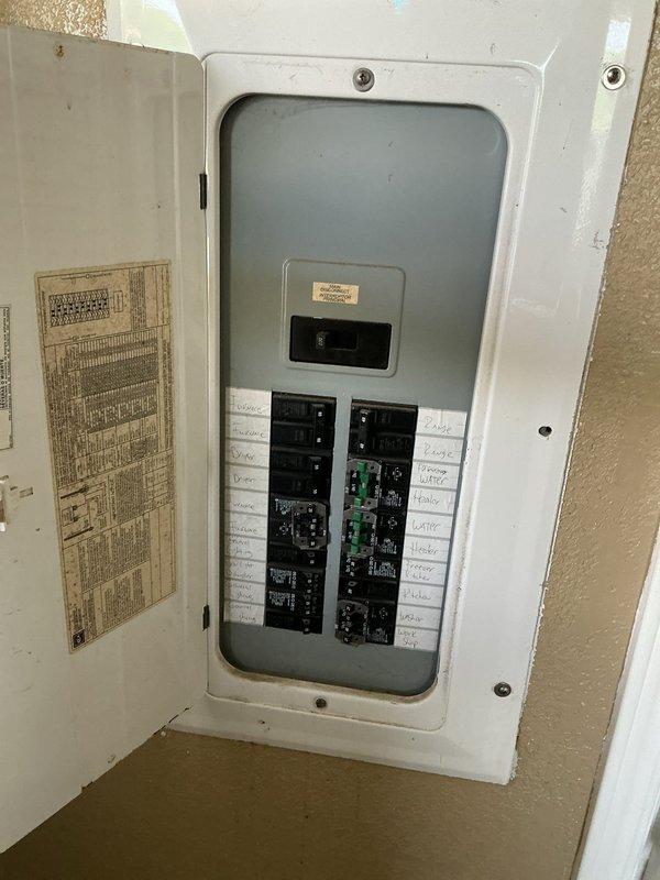 Completed comprehensive electrical maintenance inspection on manufactured home with dual panel configuration. Inspected outdoor meter panel mounted on pole near service entrance and interior breaker panel located in utility room. Both panels are approximately 26 years old, original to the structure. Verified all circuit breakers for proper operation, checked for signs of overheating or damage, and confirmed secure connections throughout both panels. Documented circuit labeling in interior panel and overall condition of weatherproof exterior panel, which showed vegetation encroachment requiring clearance advisement. All electrical components found functioning within normal parameters with no immediate safety concerns identified. This represents the first electrical service visit for this member.