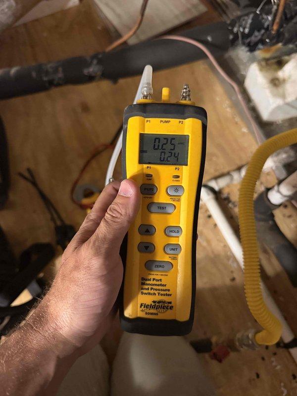 Responded to no-cooling complaint on downstairs system in a dual-zone residential installation. System is a 7-year-old unit located in interior closet with no documented maintenance history. Upon arrival, performed comprehensive diagnostic evaluation of the affected downstairs HVAC system.

Conducted electrical measurements using clamp meter, recording amperage draw of 6.80 amps on compressor circuit to verify proper electrical operation and identify potential issues with motor performance or refrigerant charge. Utilized digital manometer to measure system pressures, documenting readings of 0.25 and 0.24 on dual ports to assess refrigerant flow and identify restrictions or charge-related issues affecting cooling capacity.

Inspected all accessible components including air handler, evaporator coil connections, refrigerant lines, and electrical terminations. Evaluated condition of copper refrigerant lines, insulation integrity on suction line, and overall system cleanliness. Checked ther