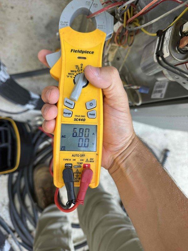 Responded to no-cooling complaint on downstairs system in a dual-zone residential installation. System is a 7-year-old unit located in interior closet with no documented maintenance history. Upon arrival, performed comprehensive diagnostic evaluation of the affected downstairs HVAC system.

Conducted electrical measurements using clamp meter, recording amperage draw of 6.80 amps on compressor circuit to verify proper electrical operation and identify potential issues with motor performance or refrigerant charge. Utilized digital manometer to measure system pressures, documenting readings of 0.25 and 0.24 on dual ports to assess refrigerant flow and identify restrictions or charge-related issues affecting cooling capacity.

Inspected all accessible components including air handler, evaporator coil connections, refrigerant lines, and electrical terminations. Evaluated condition of copper refrigerant lines, insulation integrity on suction line, and overall system cleanliness. Checked ther