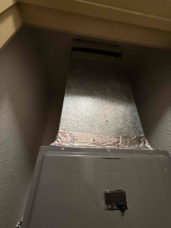 Responded to no-cooling call on 2-ton system in dual-system residential property. Upon arrival, performed diagnostic evaluation on 15-year-old unit located in closet. Inspected electrical panel to verify power supply and breaker functionality. Accessed HVAC closet and examined ductwork connections, air handler assembly, and associated components. Documented system configuration including metal supply duct, access panel, and electrical connections. Completed visual inspection of installation quality and identified system age as primary factor in cooling failure. Discussed findings with homeowner regarding repair versus replacement options given unit's age and condition.