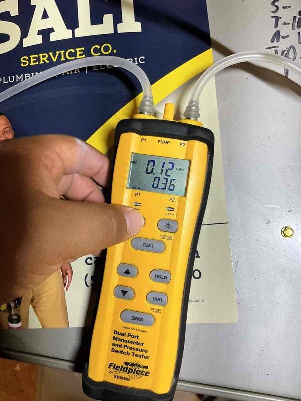 Completed comprehensive preventive maintenance tune-up on a single-zone residential HVAC system located in attic installation. Performed complete system diagnostics including refrigerant pressure testing using dual-port manometer, measuring static pressures at 0.12" and 0.36" on supply and return sides. Utilized refrigerant manifold gauge to verify system charge levels, recording high-side pressure at 316.6 psig with 74°F temperature and low-side pressure at 120.2 psig with 124°F temperature. All refrigerant pressures and temperatures within manufacturer specifications for proper system operation. Inspected condensing unit, evaporator coil, and all accessible refrigerant lines for leaks, damage, or deterioration. System operating efficiently with no deficiencies noted during diagnostic testing.