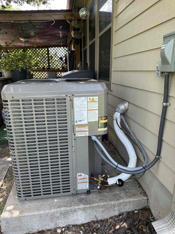 Completed sales consultation for complete HVAC system replacement at residential property. Customer approved for financing and requested temporary portable unit for living room during installation, as family has been displaced to master bedroom. Existing concrete pad in satisfactory condition for new equipment installation, eliminating need for additional pad preparation. Documented current York brand outdoor condensing unit positioned on exterior concrete pad with proper clearances, refrigerant line sets, and electrical disconnect in place for reference during replacement process.
