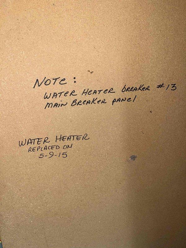 Responded to service call for leaking 11-year-old electric tank water heater located in garage. Upon inspection, confirmed active leak from Whirlpool unit with expansion tank and recirculating system installed. Documented current system configuration including breaker location (#13 on main panel) and photographed equipment condition, noting previous replacement performed in 2015. Provided customer with replacement options and quotes for new water heater installation.