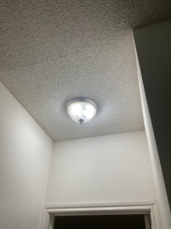 Responded to service call for malfunctioning light switch that would not turn off in 31-year-old residential property. Upon arrival, inspected the affected switch and ceiling-mounted dome light fixture with frosted glass shade. Removed wall plate and extracted switch from electrical box to diagnose the issue. Found faulty toggle switch mechanism with internal contact failure preventing proper off position engagement. Disconnected existing switch, verified wire connections and junction box integrity, and installed new residential-grade light switch. Secured switch to mounting bracket with appropriate hardware, confirmed proper wire termination with twist connectors, and reinstalled wall plate. Tested switch operation through multiple on/off cycles to verify complete functionality and proper circuit control of overhead lighting fixture.