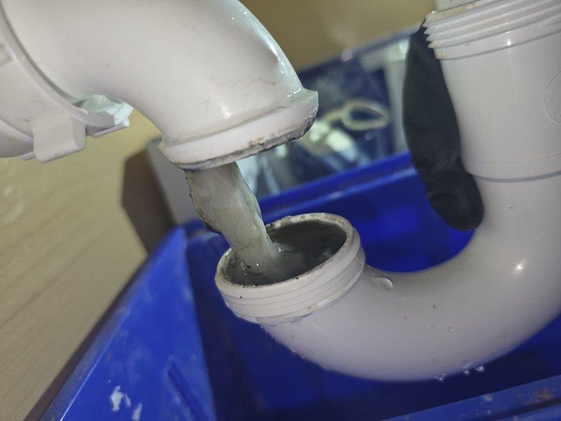 Responded to follow-up plumbing call for HVAC condensate drain cleaning at 19-year-old residential property. Previous day's HVAC service identified clogged condensate drain line requiring plumbing intervention. Accessed exterior condensate drain system connected to air conditioning unit. Performed thorough cleaning and flushing of PVC condensate drain lines to remove accumulated biofilm, algae, and debris causing drainage restriction. Disassembled drain line sections as needed to ensure complete removal of blockage material. Flushed system with cleaning solution to restore proper flow and prevent future buildup. Reassembled all PVC fittings and connections, verifying proper drainage and system function before completion.