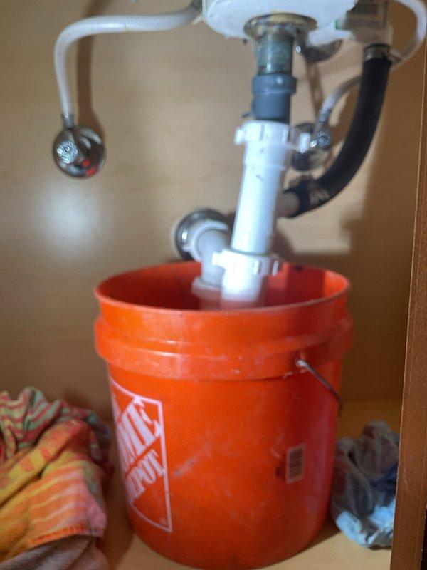 Responded to after-hours service call for sink stoppage in Jack and Jill bathroom. Successfully cleared drain obstruction in bathroom sink using mechanical snake and verified proper drainage flow. Disassembled P-trap assembly to access blockage, removed accumulated debris causing recurring annual stoppage, and reassembled all drain components with proper seals. Inspected remaining toilets throughout home as requested and confirmed all wax ring seals are secure with no signs of leakage or movement. System restored to full operation with no leaks detected upon testing.