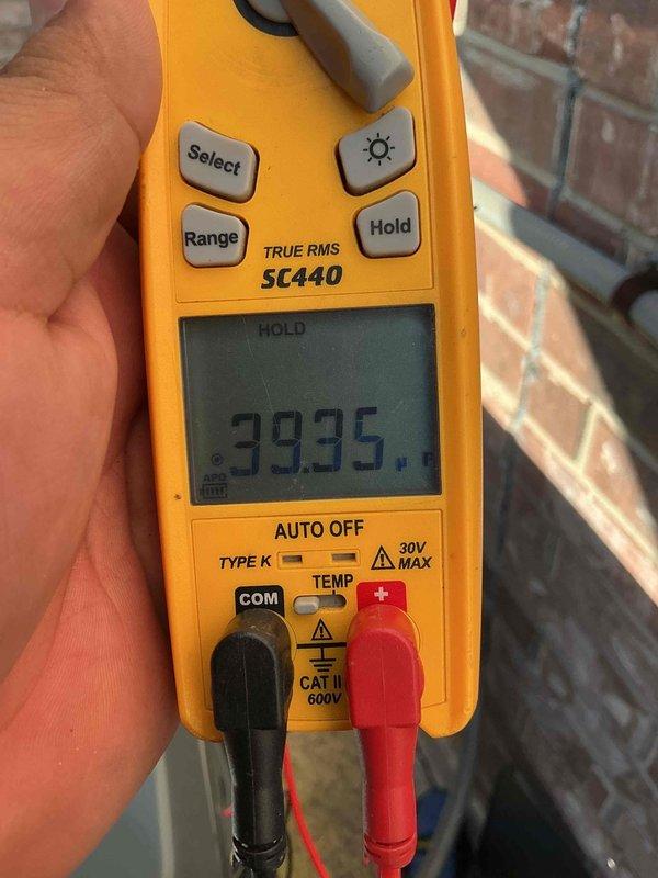 Performed comprehensive non-member maintenance service on two HVAC systems located in attic of 3,990 square foot residential property. Both units are original to the 20-year-old home with an estimated age of 15+ years and no documented prior maintenance history. Attic access was clean, safe, and accessible for thorough inspection and service work.

Conducted complete diagnostic evaluation and tune-up procedures on both systems. Performed electrical testing using digital multimeter, recording voltage readings of 39.35V and amperage draw of 1173 on system components to verify proper electrical operation and identify any performance concerns. Inspected all accessible ductwork, including flexible insulated ducting, for proper connections, air leaks, and general condition. Evaluated system controls, safety switches, and operational sequences on both units.

Completed standard maintenance protocols including filter inspection, condensate drain evaluation, and visual assessment of all major c