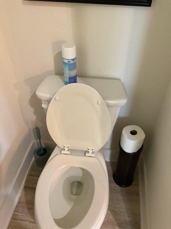 Completed comprehensive plumbing maintenance inspection on residential property with two exterior-mounted water heating units. Performed initial baseline assessment of wall-mounted tankless water heater system located in exterior alcove, documenting unit configuration, ventilation, gas and water connections, and overall serviceability. Conducted interior plumbing fixture inspection including toilet operation and functionality. Documented current condition of both water heating units, noting 7+ year age classification, and established maintenance baseline for future service intervals.