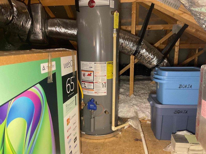 Responded to recurring pilot light outage on 7-year-old gas tank water heater located in attic. Diagnosed intermittent pilot failure that occurred twice within two days, requiring reignition after initial attempt. Performed comprehensive inspection of thermocouple, gas control valve, and pilot assembly to identify root cause of repeated outages. Evaluated both attic-mounted gas water heaters for proper venting, draft conditions, and potential sediment accumulation that could affect burner operation. Tested pilot flame strength and thermocouple millivolt output to ensure adequate safety circuit function. Inspected flue assembly and combustion air supply for proper draft and ventilation in attic environment. Documented operational status of both units and provided technical findings regarding pilot system reliability.