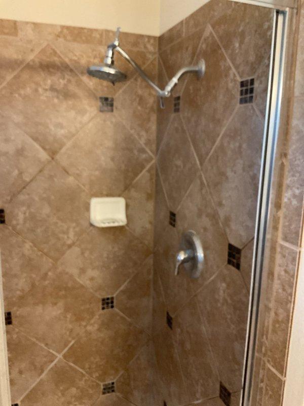 Completed comprehensive plumbing maintenance service on 3,731 square foot residential property built in 2009. Performed scheduled maintenance visit that was deferred from previous after-hours drain service call earlier in the week.

**Water Heater Inspection:**
Accessed attic-mounted gas tankless water heater (approximately 7 years old). Conducted visual inspection of unit exterior and mounting. Checked venting system for proper installation and clearances. Inspected gas connections for leaks and proper fitting. Verified condensate drain line is clear and draining properly. Tested unit operation and confirmed adequate hot water delivery. Noted unit is functioning within normal parameters.

**Kitchen Plumbing Inspection:**
Inspected under-sink plumbing at kitchen location. Examined white PVC P-trap assembly and all coupling connections for signs of leakage or deterioration. Verified proper trap seal and drainage. Inspected garbage disposal unit mounting and electrical connections. Check